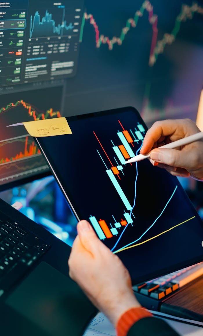 home-hero-bg Person using a tablet to analyze financial charts for trading insights. Perfect for finance and technology themes.