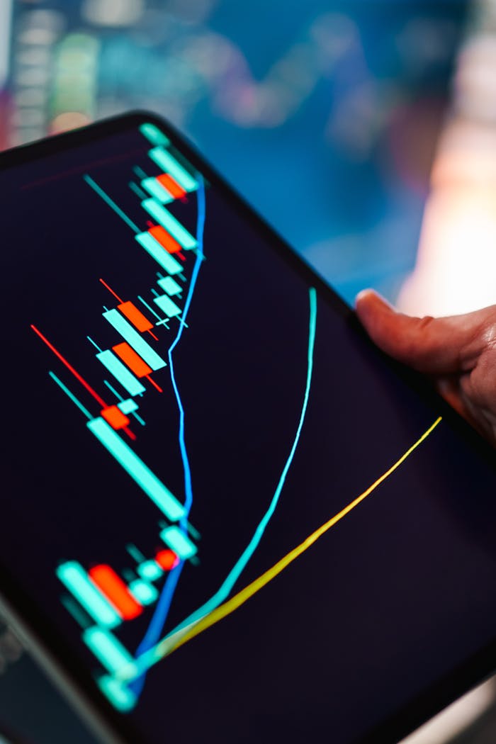 home-services-01 A close-up of a tablet displaying a colorful candlestick chart, ideal for finance and technology themes.